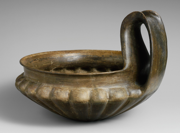 Terracotta kyathos (single-handled cup), 7th century B.C.E., Late Villanova, terracotta, buccheroid impasto, 4 9/16 in high without handle, 8 11/16 in with handle, 11 in diameter of mouth (The Metropolitan Museum of Art)